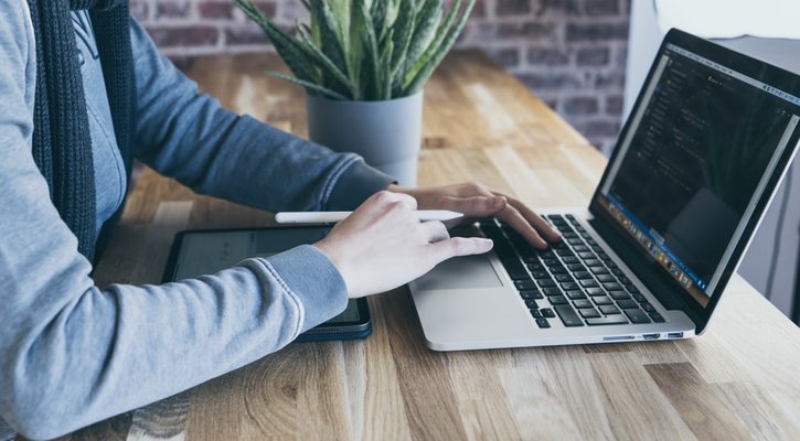 hand on laptop